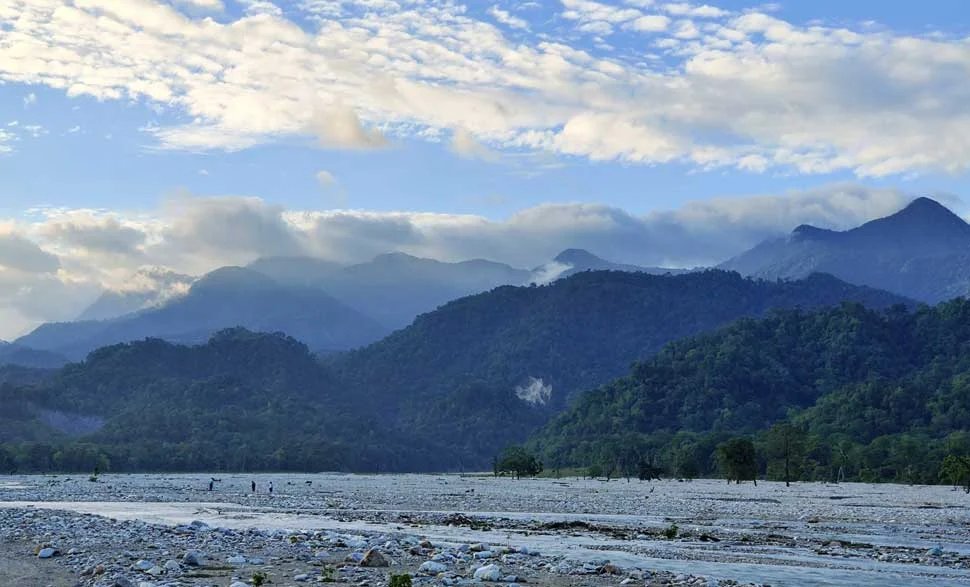 The wide, dry riverbed and Bhutan mountains of Jayanti in Buxa Tiger Reserve