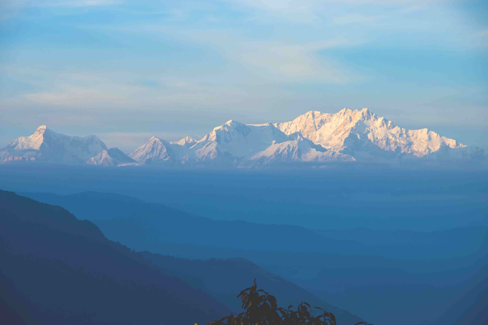 A spectacular golden sunrise over the majestic Himalayas viewed from Tiger Hill during a premium Darjeeling car tour