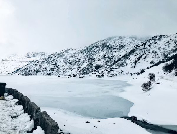 The frozen Tsomgo Lake on the way to Nathula Pass in winter